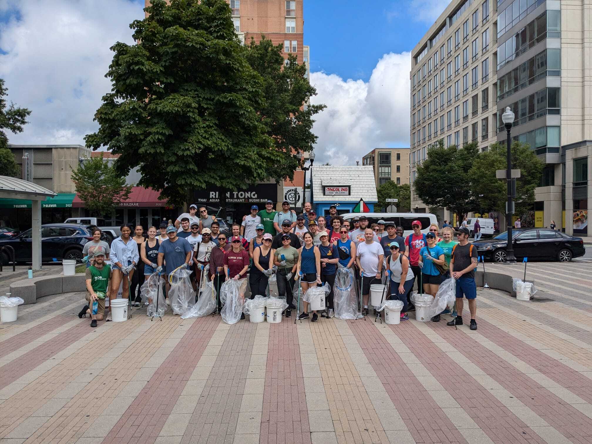 Volunteers celebrating 2 years of cleaning up neighborhoods