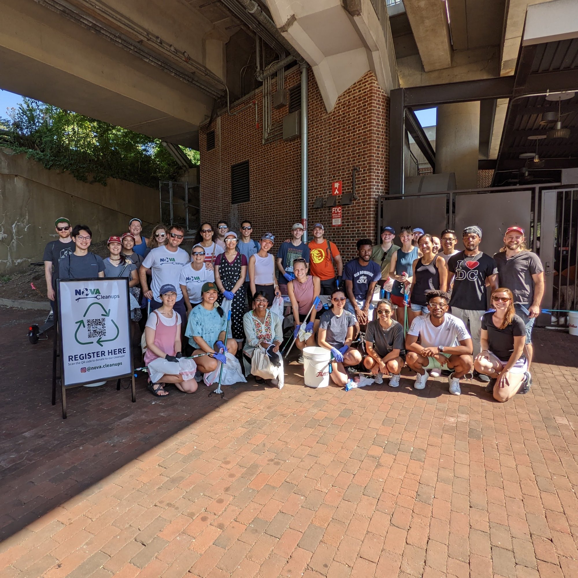 Group pic in front of the Old Town Alexandria metro stop ready to clean up